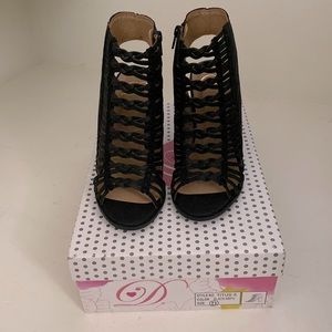 Black block strap heels with zip